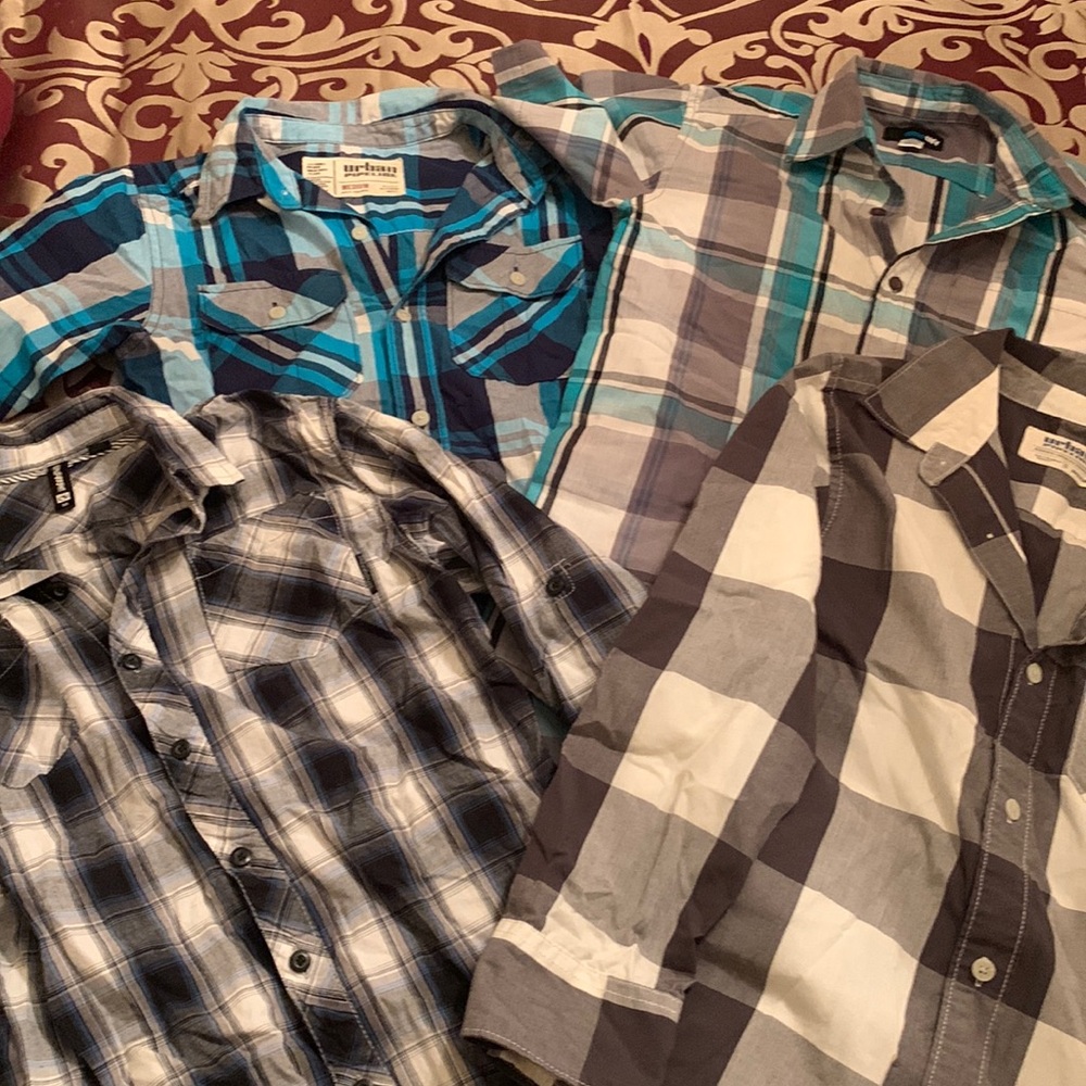 Lot of boys plaid button up shirts.